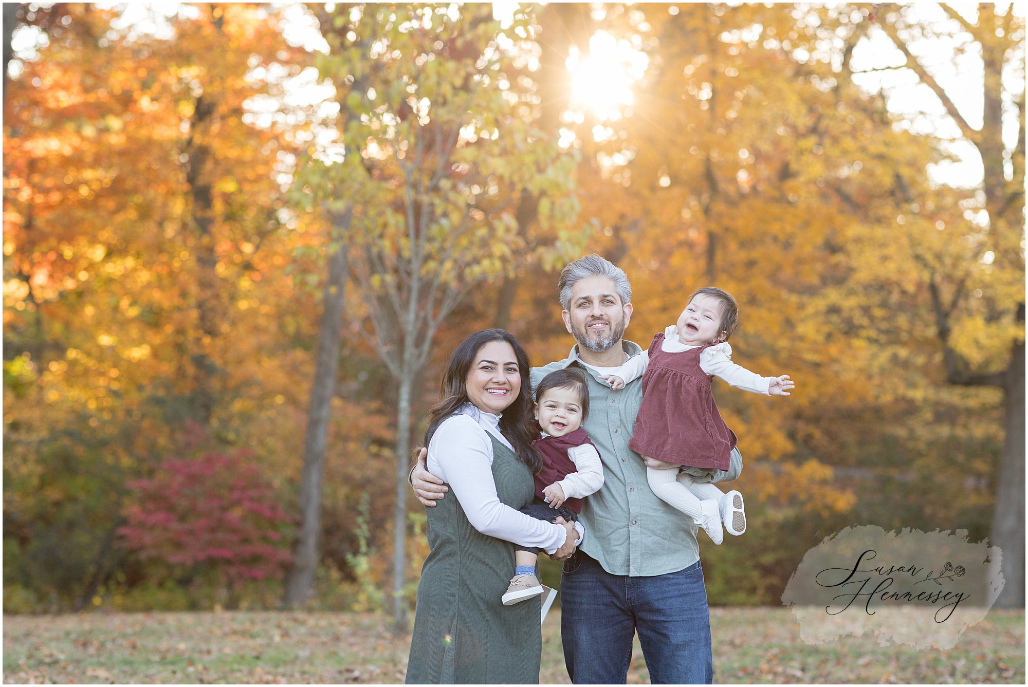 Fall family photos in Moorestown NJ with parents and children surrounded by autumn foliage