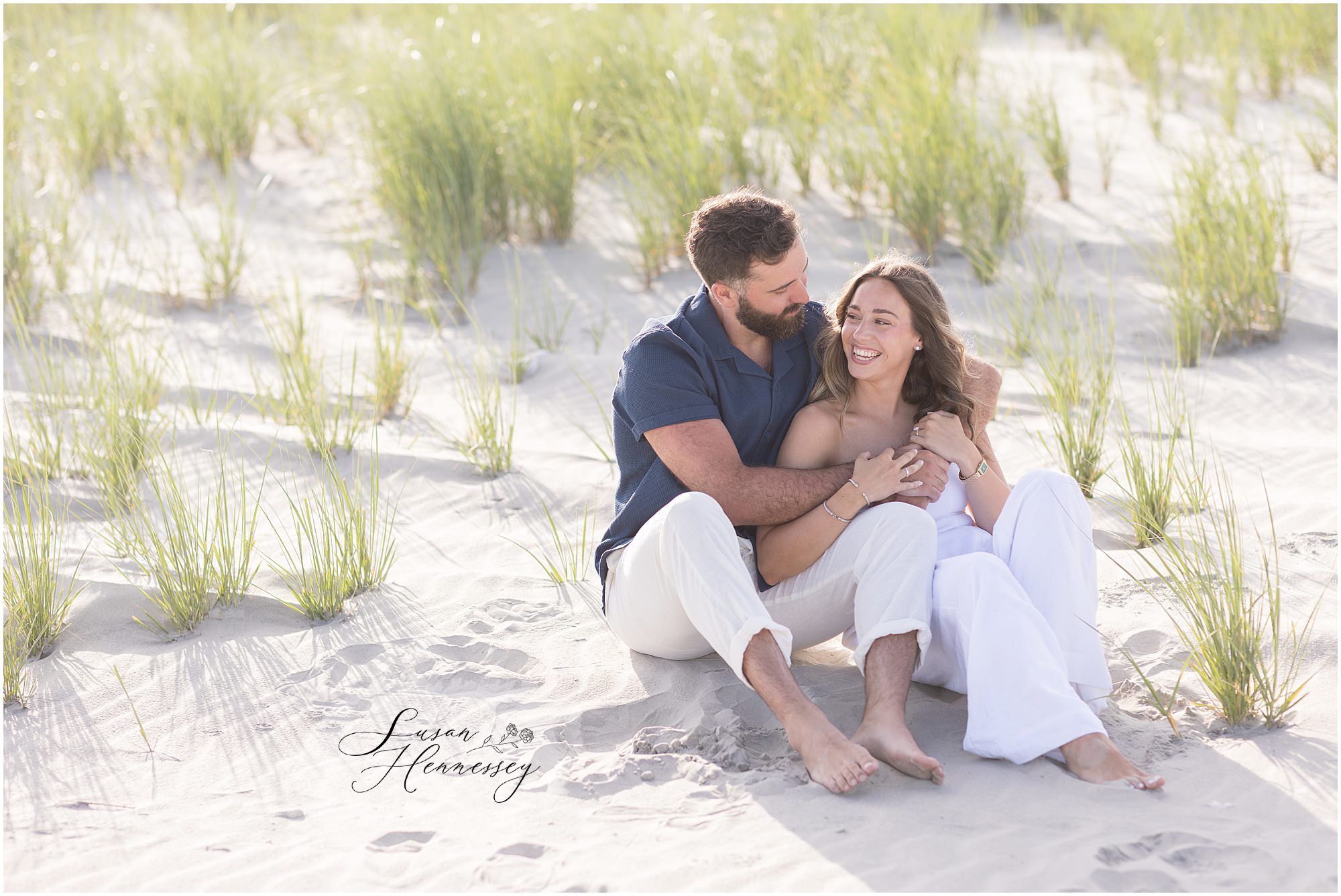 Kara and Christian smiling during their Jersey Shore engagement session