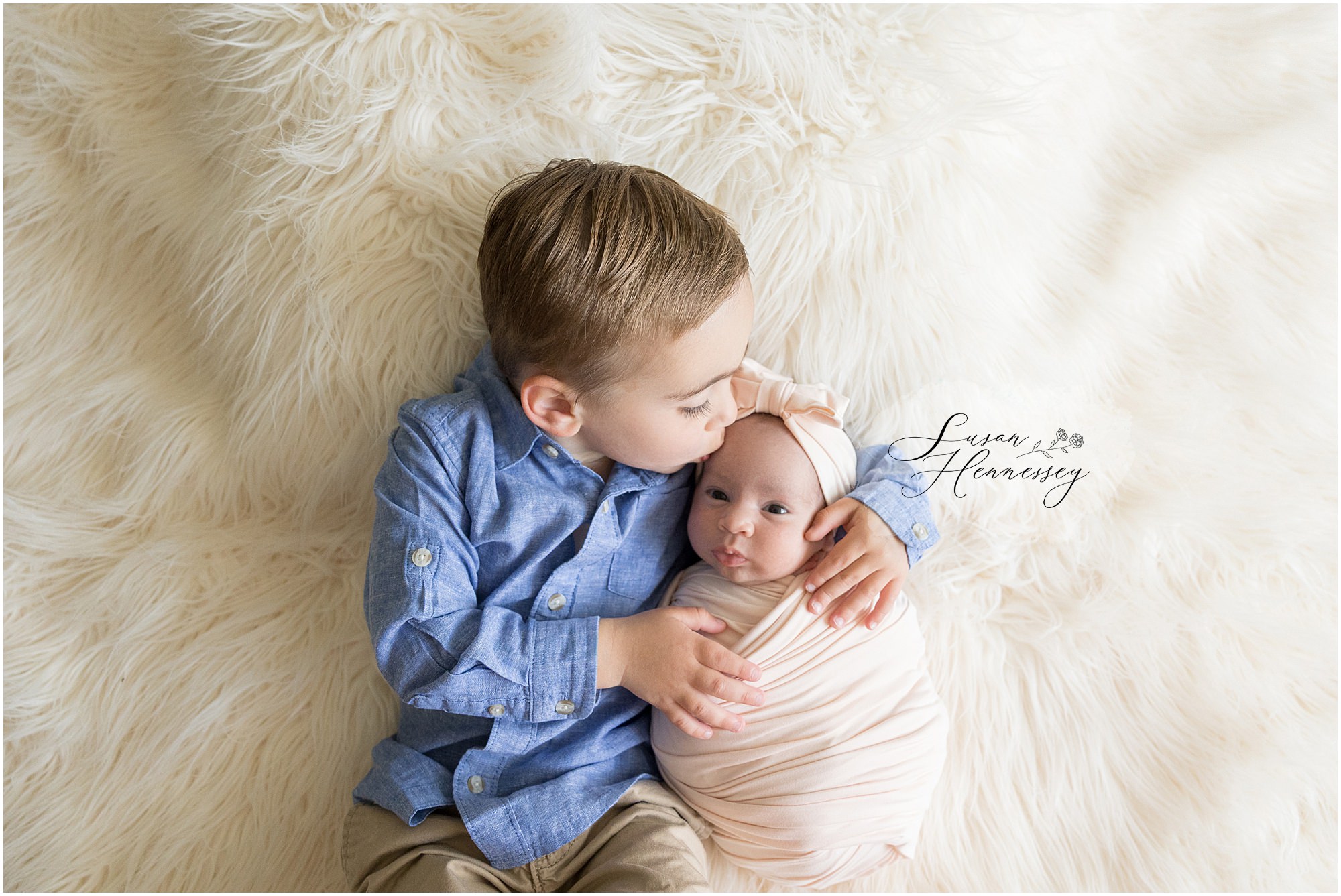 Sibling newborn photo of baby Natalie with big brother Brooks in South Jersey studio