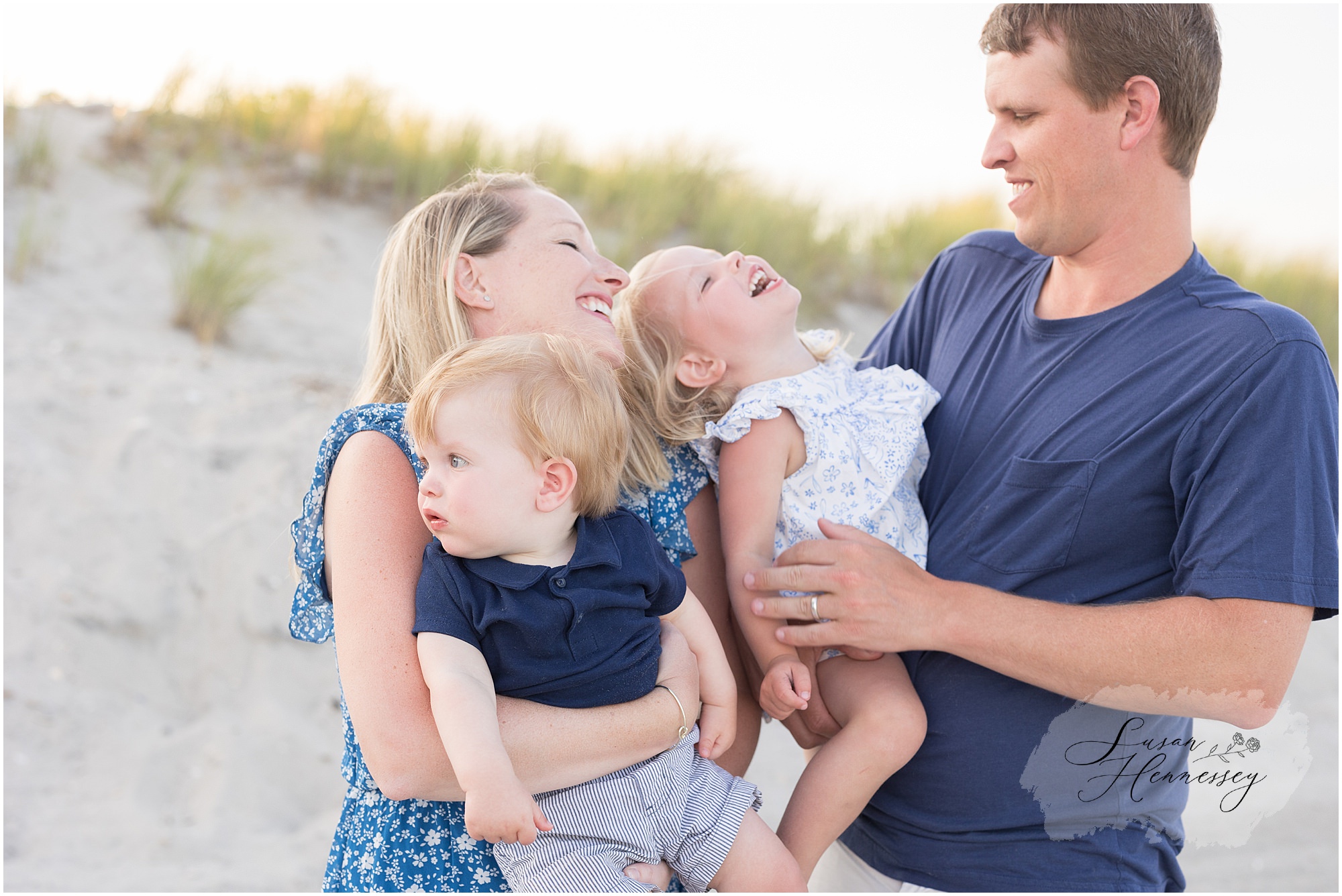 Parents and children laughing together during a Jersey Shore beach photography session
