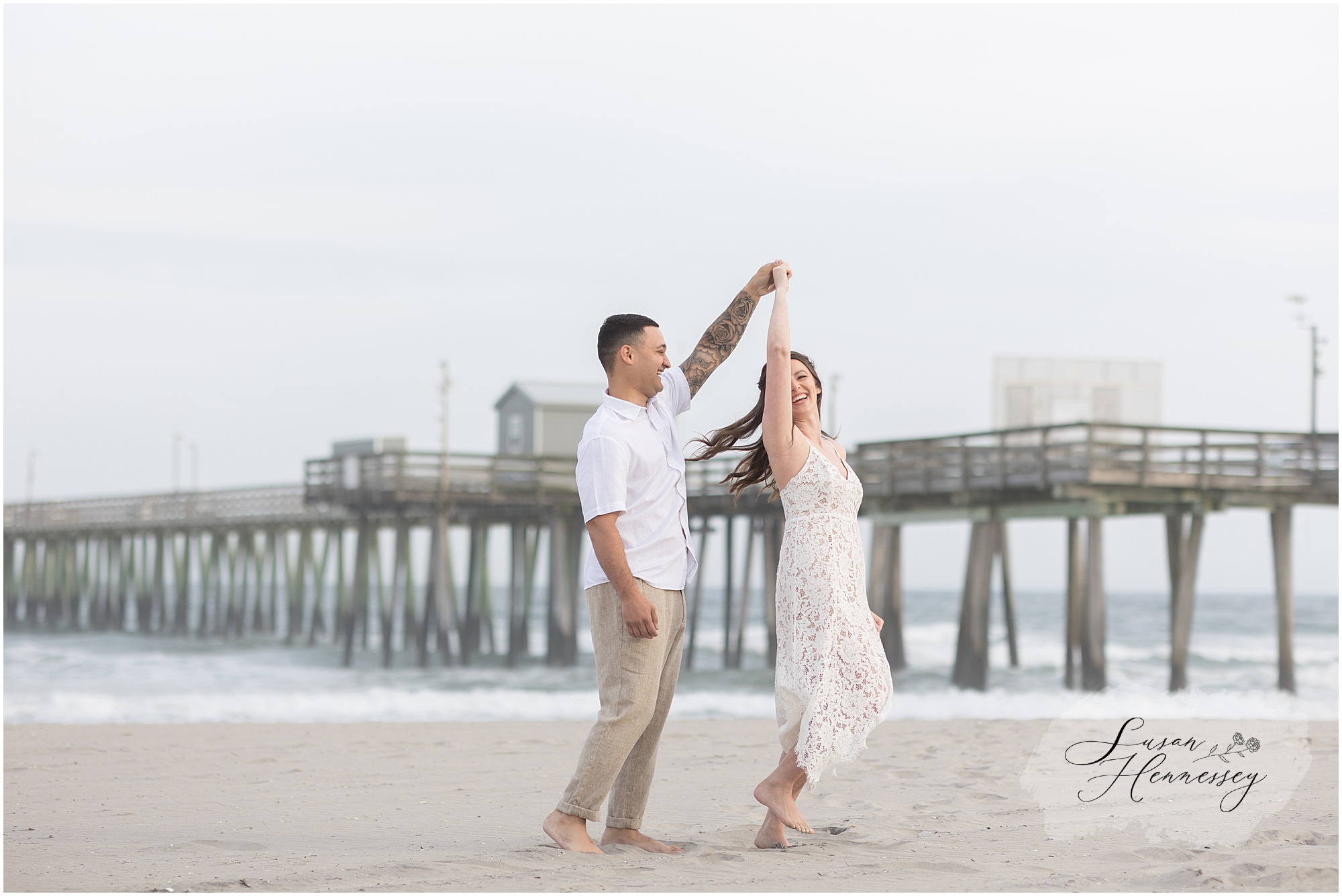 Couple walking hand in hand along the Jersey Shore during sunset photos