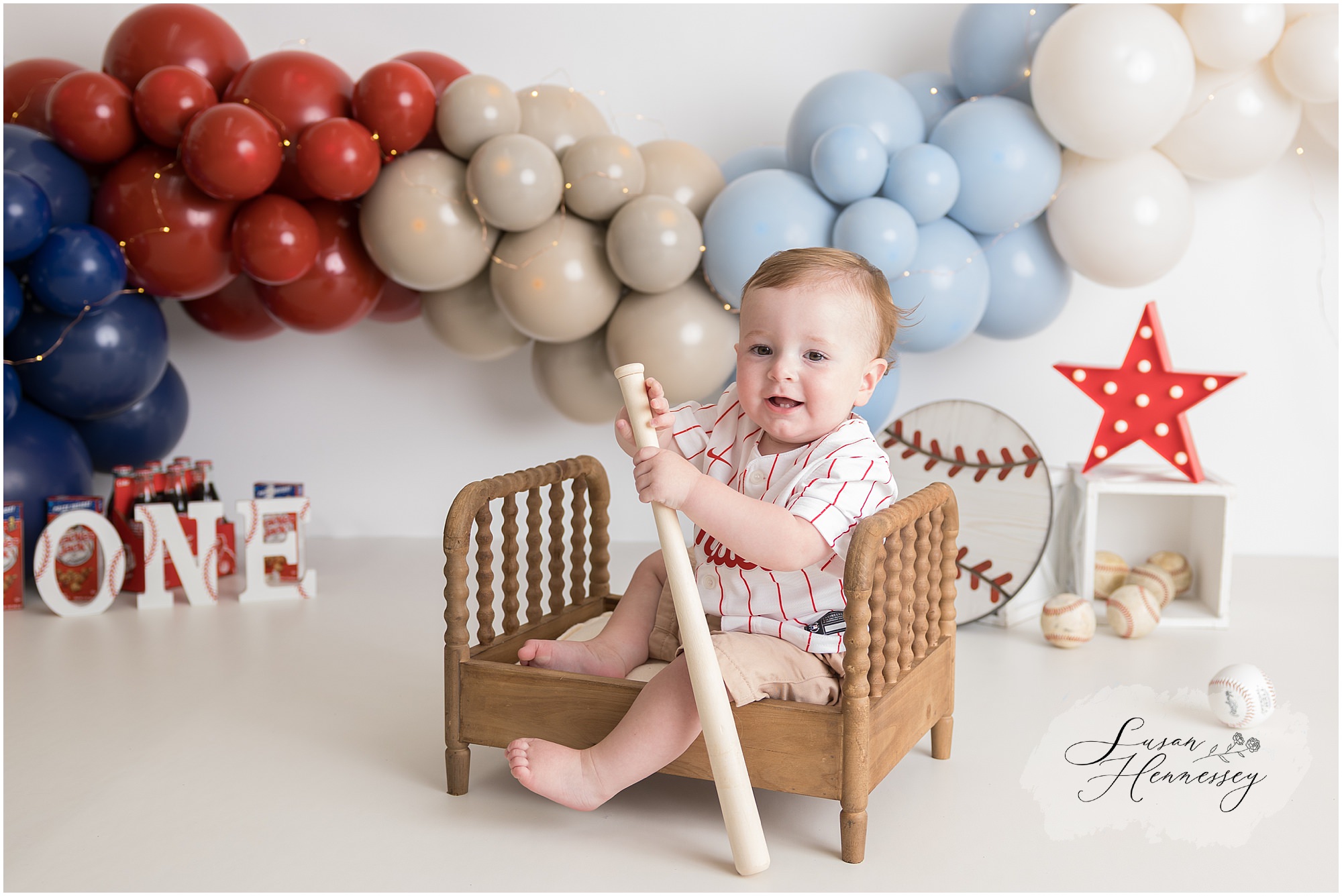 custom balloon garland cake smash session red blue tan