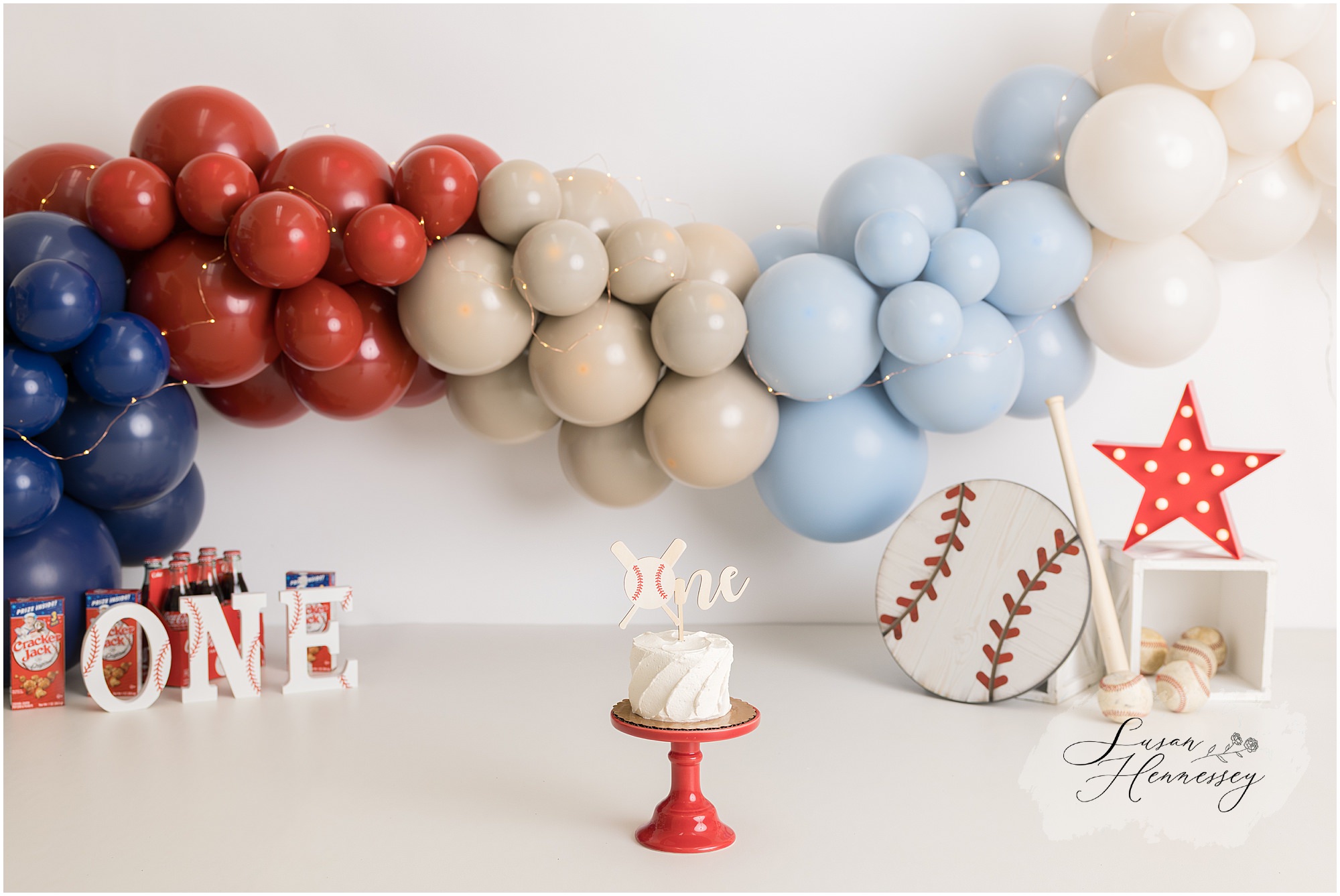 first birthday cake smash Phillies theme neutral backdrop