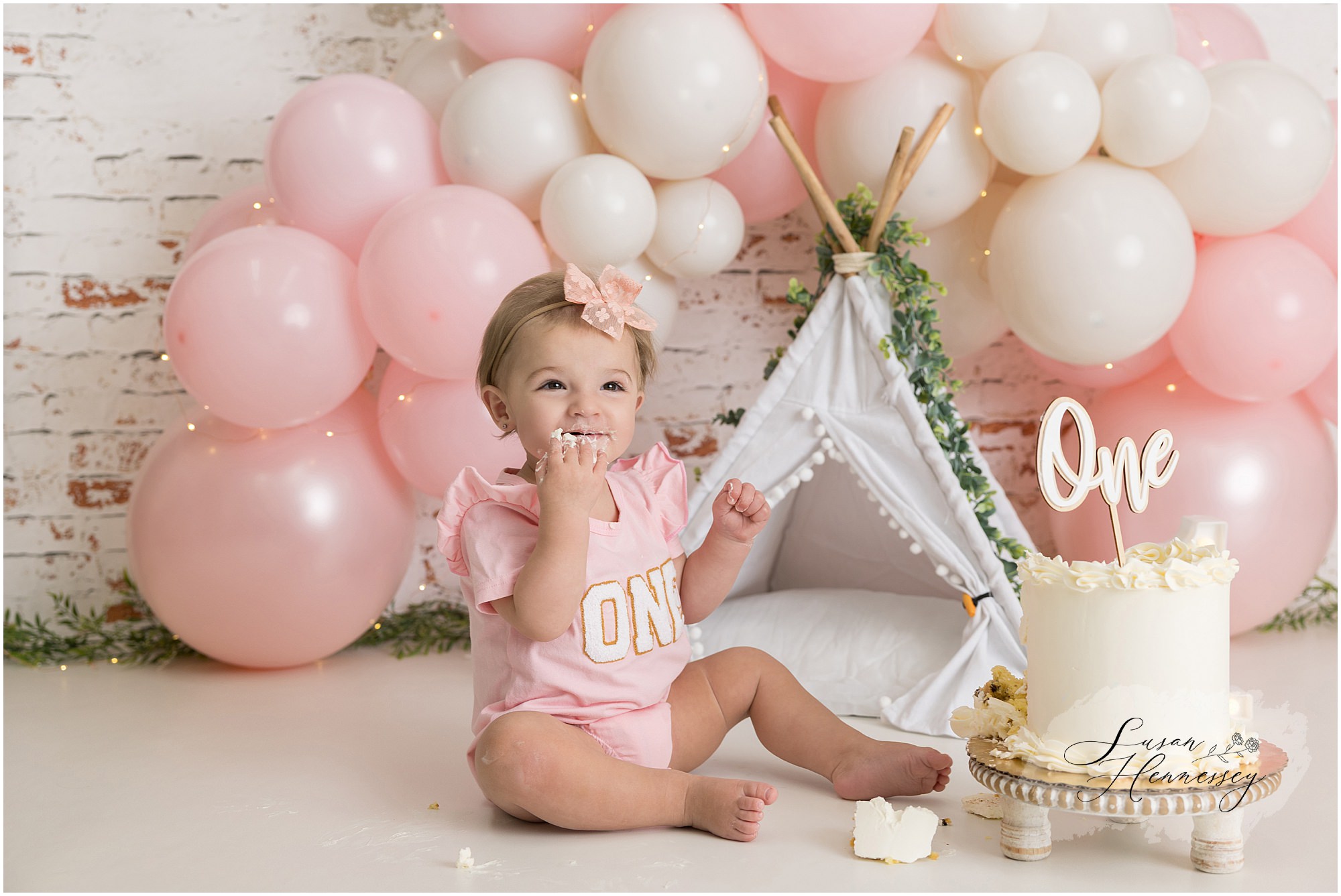 One year old girl smashing her birthday cake during a South Jersey cake smash session