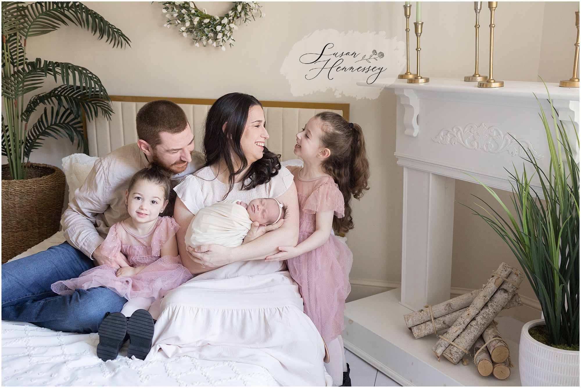Candid sibling moment with newborn baby girl in South Jersey newborn photography studio
