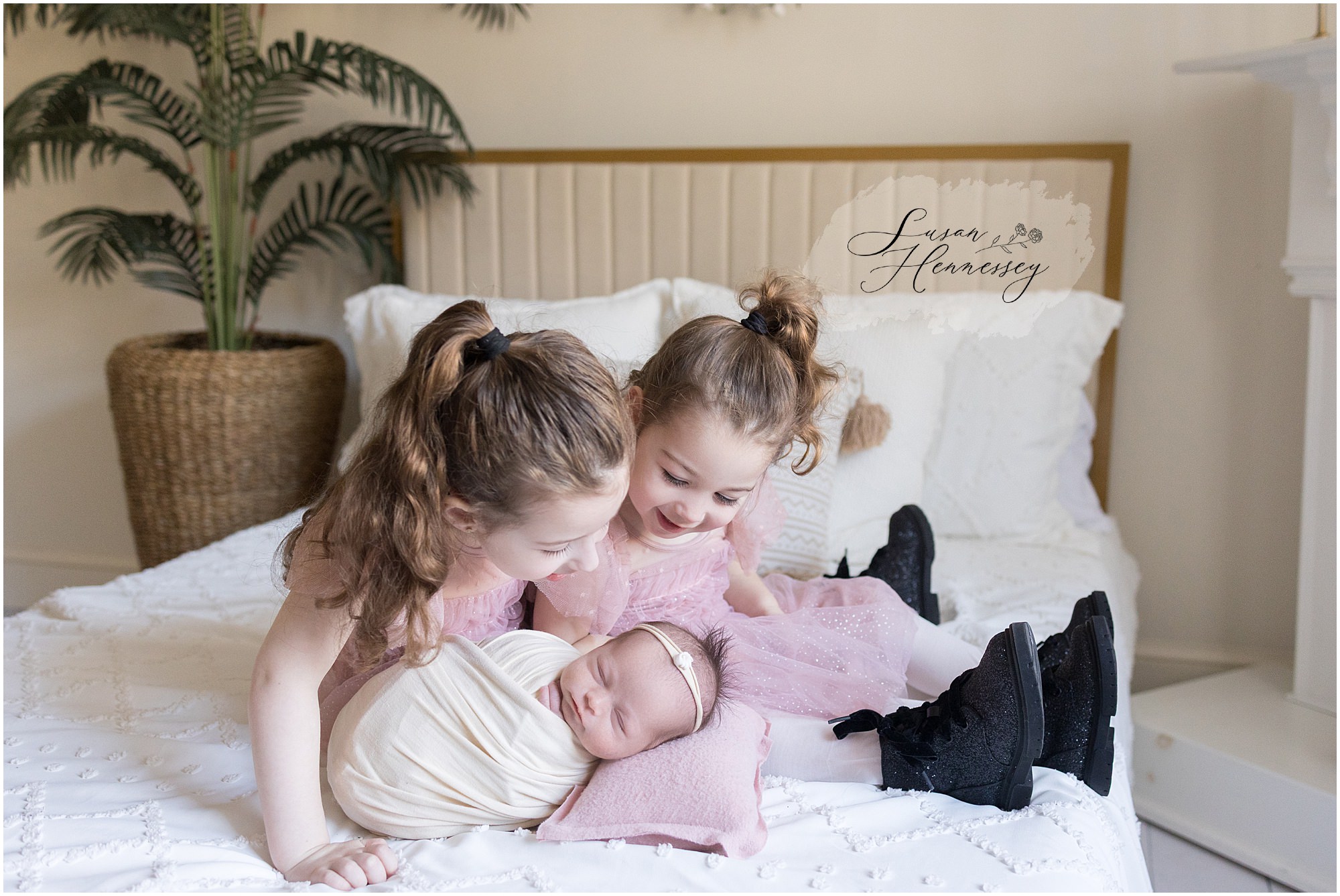 Sweet sibling moment with newborn baby girl in South Jersey newborn photography studio