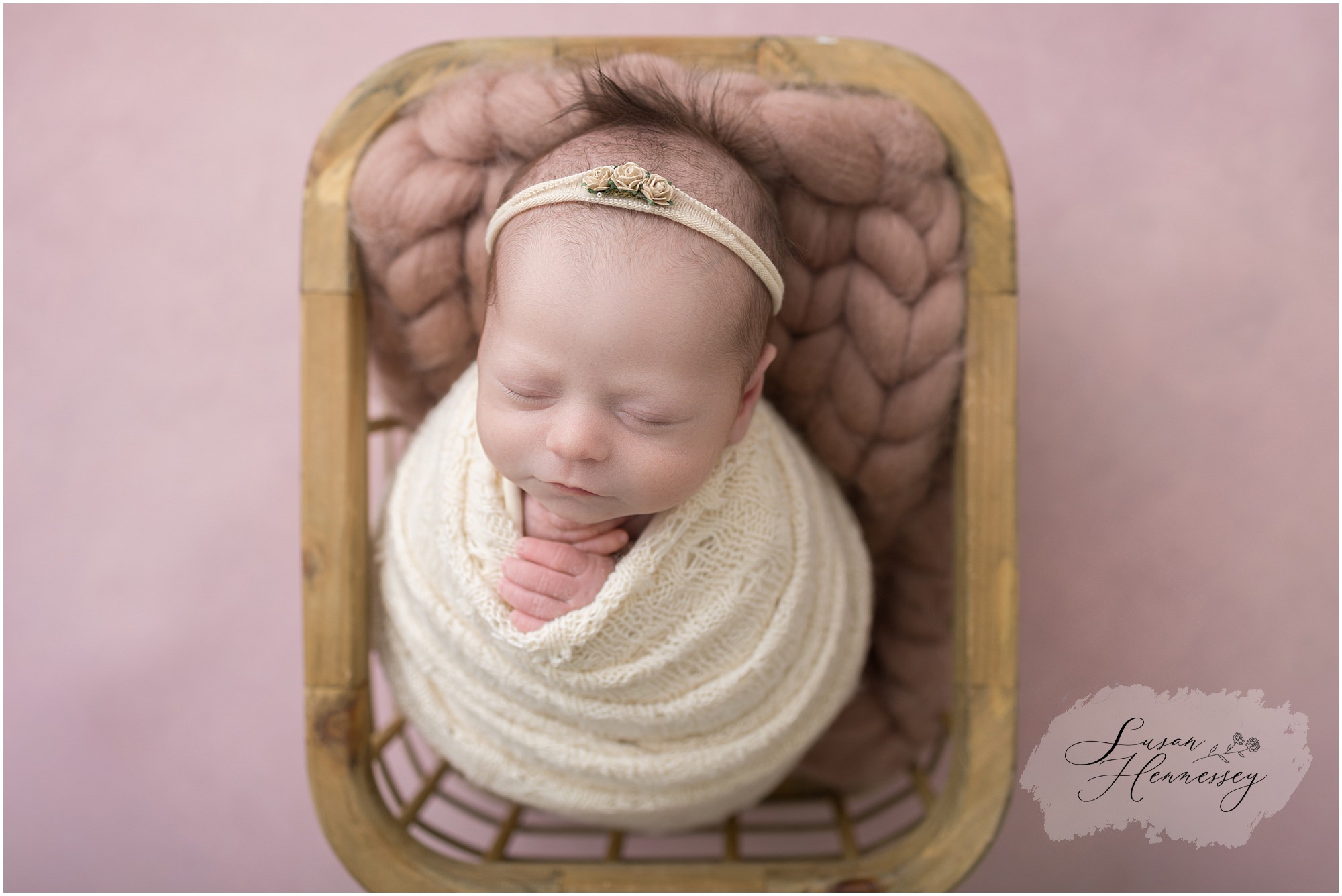 Baby Isabel wrapped in soft neutral tones during South Jersey newborn photography studio session