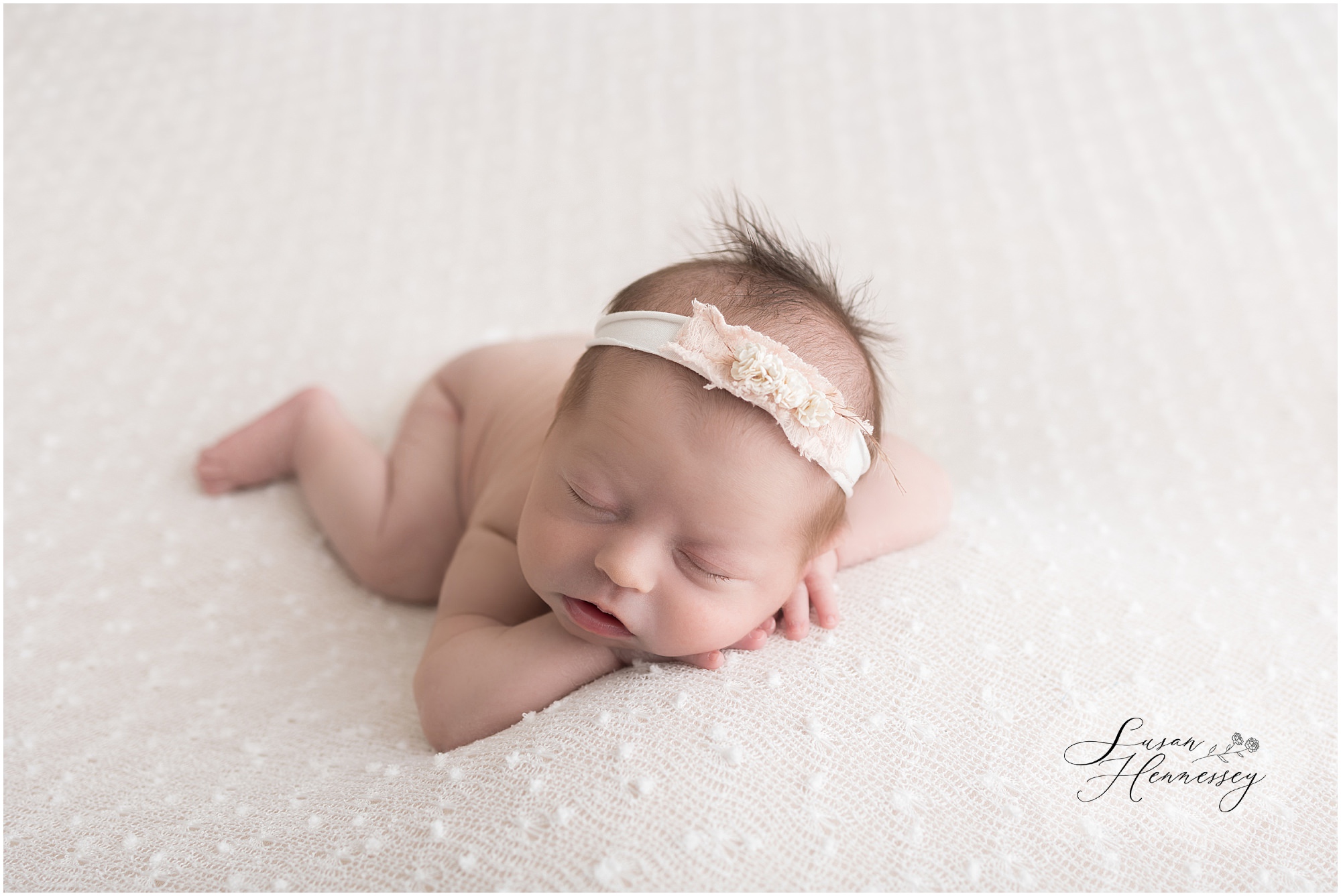 Baby Isabel peacefully sleeping on a soft blanket in South Jersey newborn photography studio