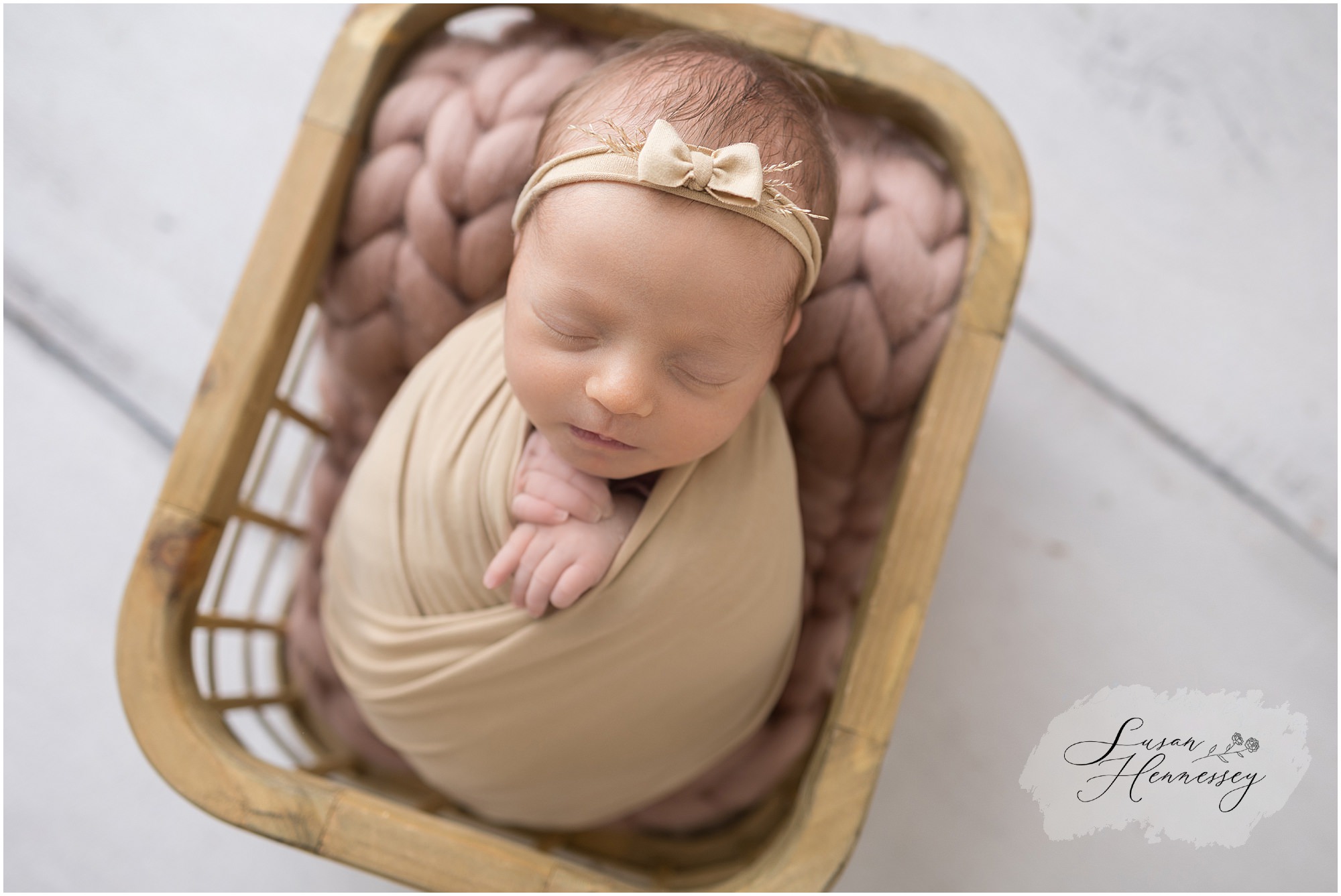 South Jersey newborn photographer baby girl posed in tan and blush tones
