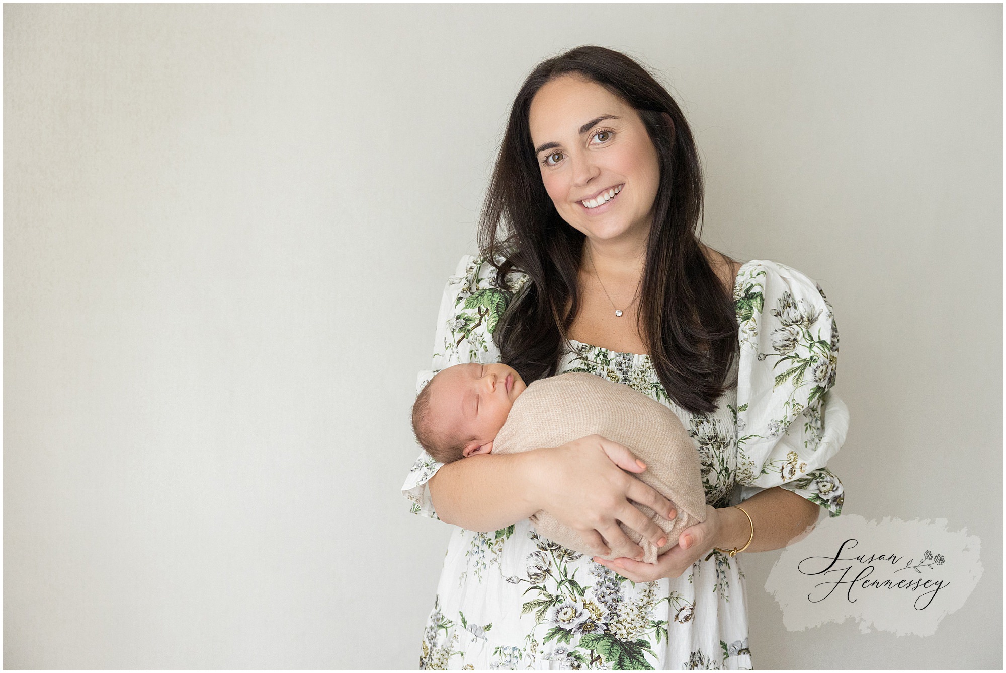 Coastal-inspired newborn photography featuring soft green tones