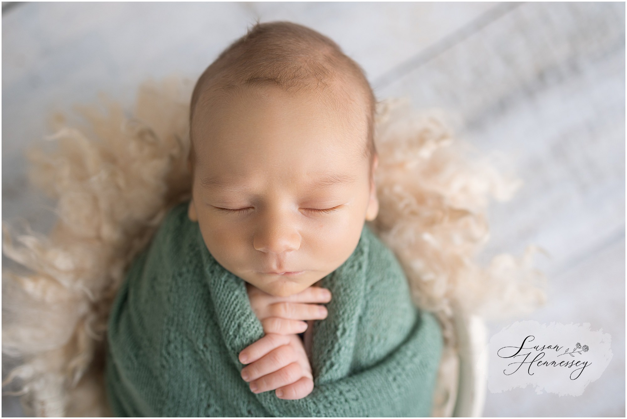 Newborn baby portrait with cream and tan styling
