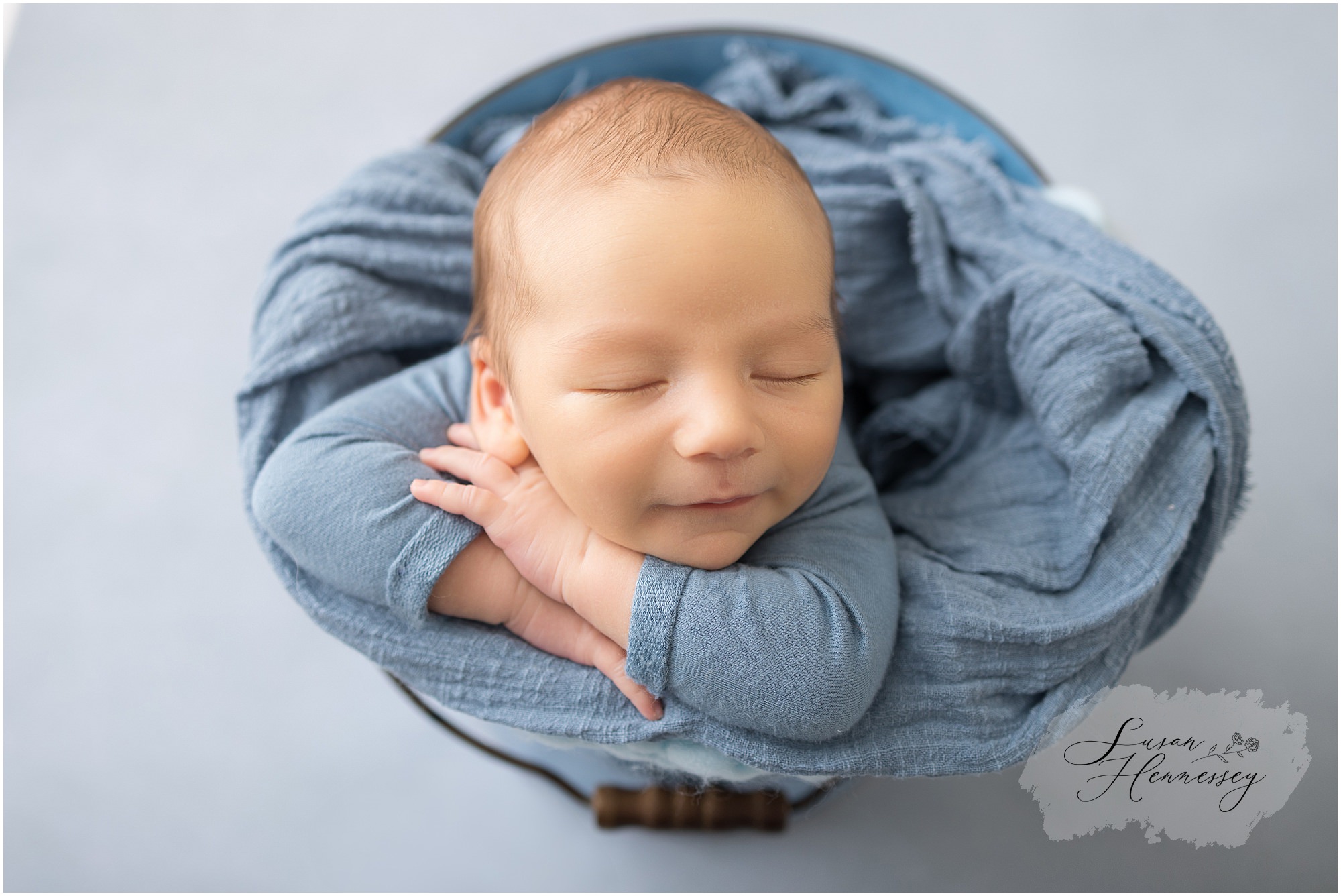 Newborn portrait featuring soft coastal-inspired colors