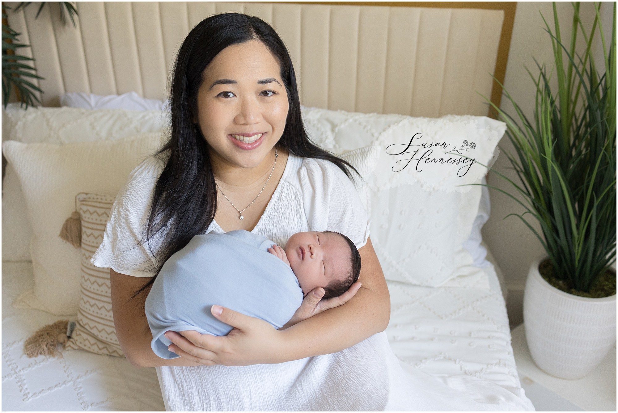 Mother cuddling baby Leo in Moorestown NJ newborn photography studio