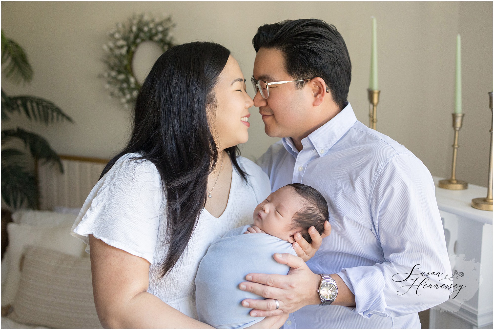 Parents holding their newborn baby during Moorestown NJ photography session