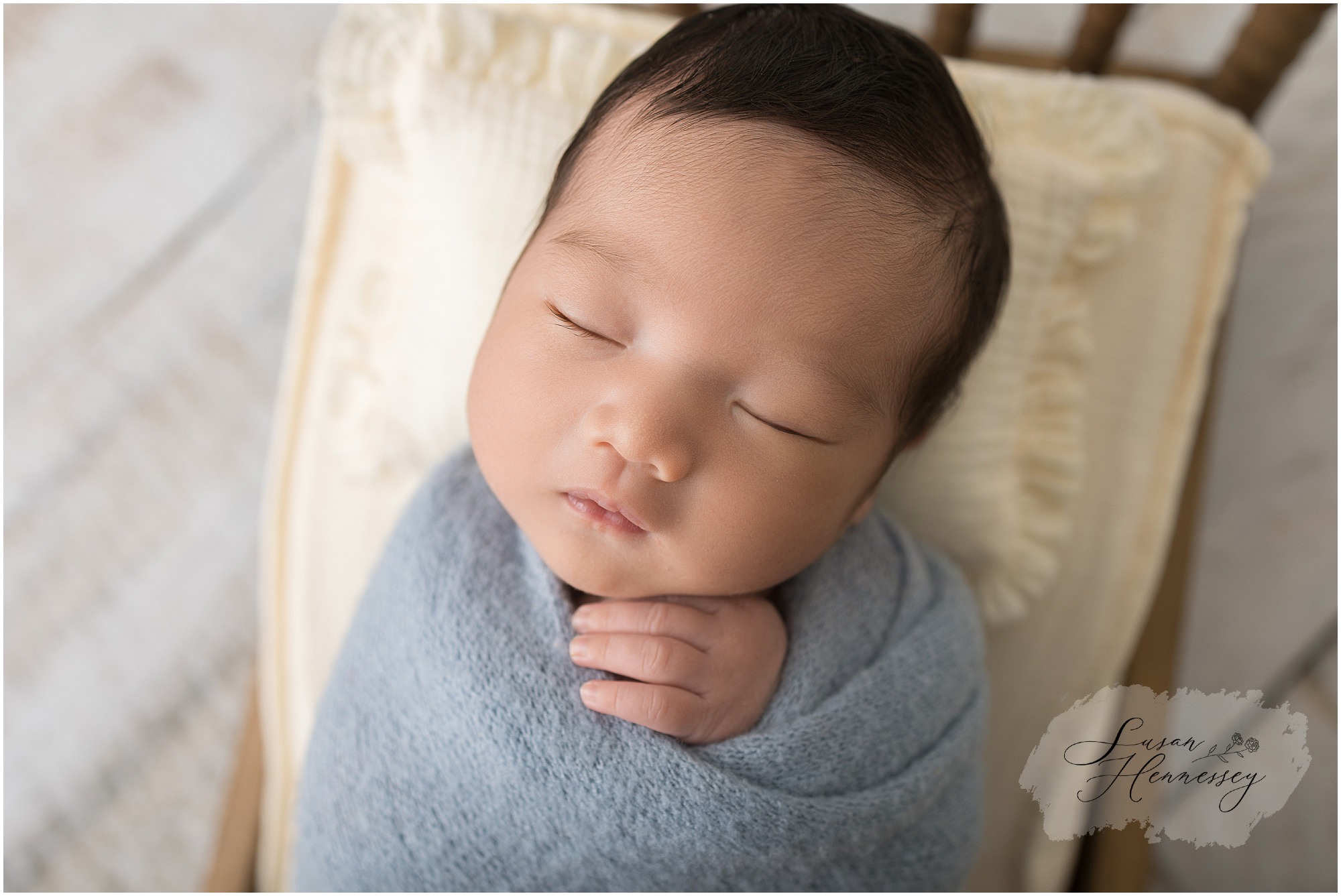 Newborn photography prop setup with blue wraps in Moorestown NJ studio