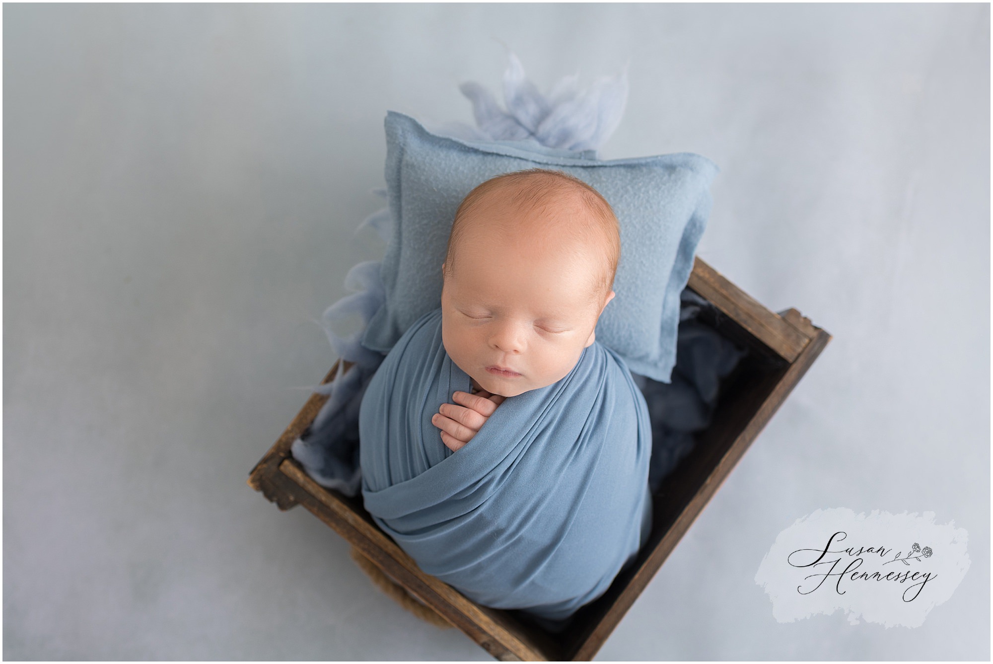 Classic blue newborn portrait of baby Jack photographed in a South Jersey studio.