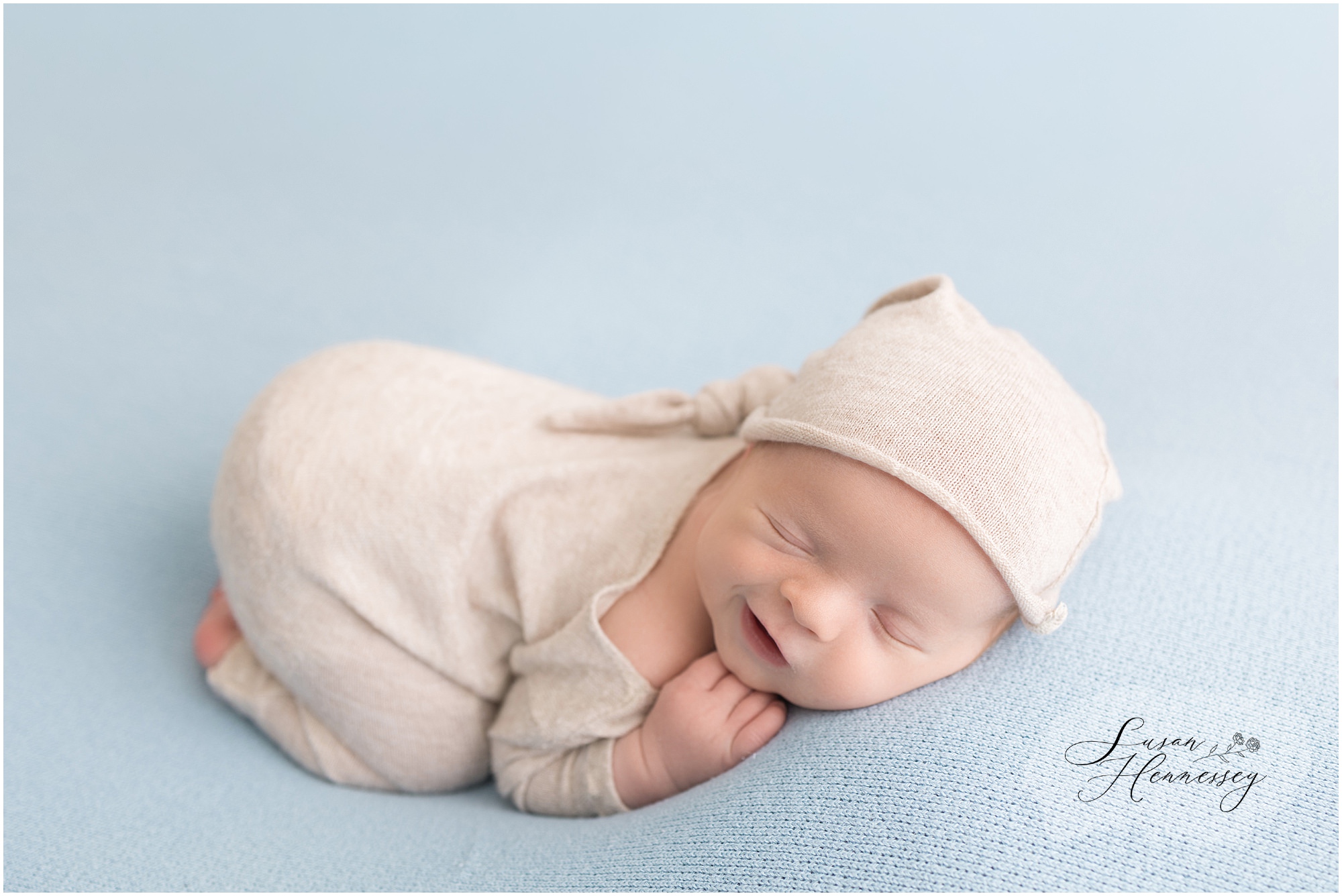 Baby Jack curled up asleep during his South Jersey newborn photography session.